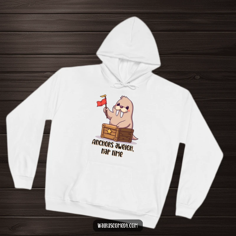 Funny hoodie depicting a jolly walrus seated on a treasure chest, enthusiastically waving a miniature flag, radiating happiness.
