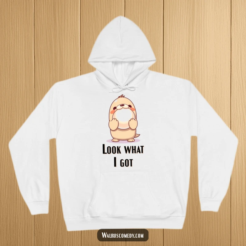 Funny Hoodie featuring a Kawaii walrus excitedly showing off a giant, shiny pearl with innocent, wide-eyed wonder.