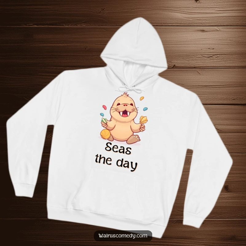 Funny Kawaii Walrus Juggling Seashells Hoodie, a happy walrus juggling shells, comfortable and cheerful apparel.