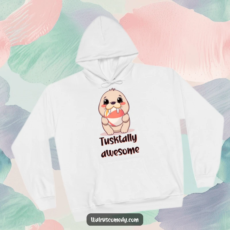 Funny cozy hoodie showcasing a kawaii walrus with big eyes, skillfully balancing a beach ball on its nose, radiating warmth and charm.