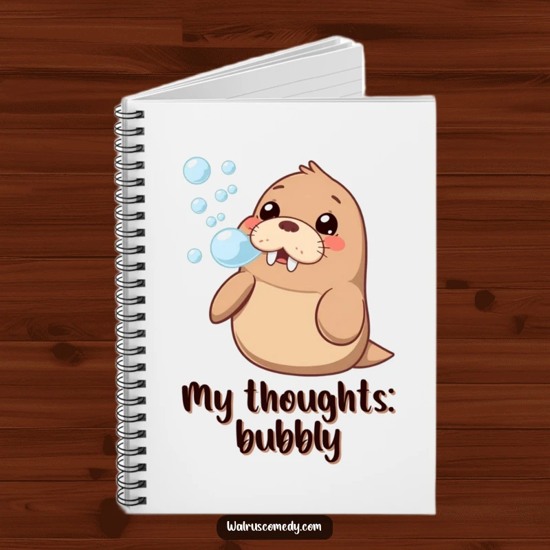 Funny kawaii walrus artistically blowing a stream of bubbles with a happy, curious look, featured on the cover of a notebook.