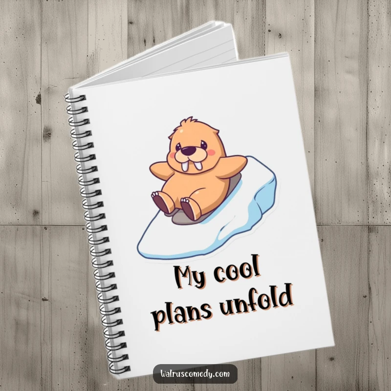 Funny kawaii walrus notebook featuring a happy walrus sliding down an icy hill, ideal for note-taking with winter flair.
