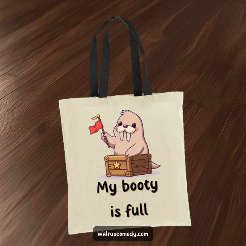 Funny tote bag showcasing a happy walrus on a treasure chest, waving a small flag, perfect for carrying your adventure gear.