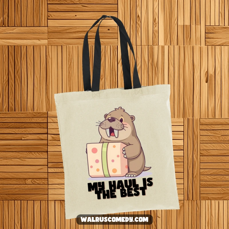 Funny tote bag showcasing a walrus character excitedly opening a large gift, ideal for carrying items with humorous flair.